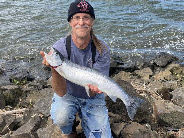 Author shows off his steelhead and smiles