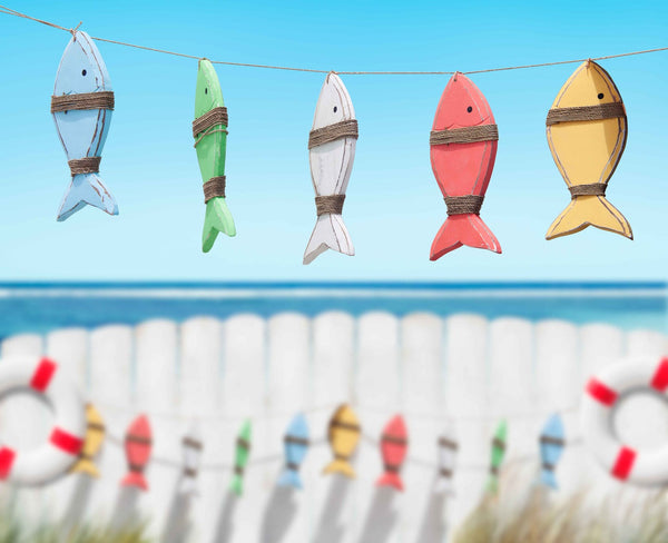 fish toys handling by beach<a href="https://www.freepik.com/free-photo/fish-toys-handing-by-beach_2791843.htm#fromView=search&page=1&position=10&uuid=493f0814-cdfb-4db0-aab3-d01b1af3a8a0">Image by rawpixel.com on Freepik</a>