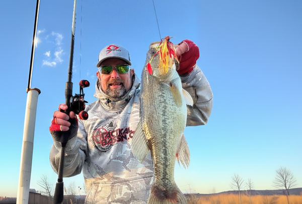 Author holding a bass in front of the camera