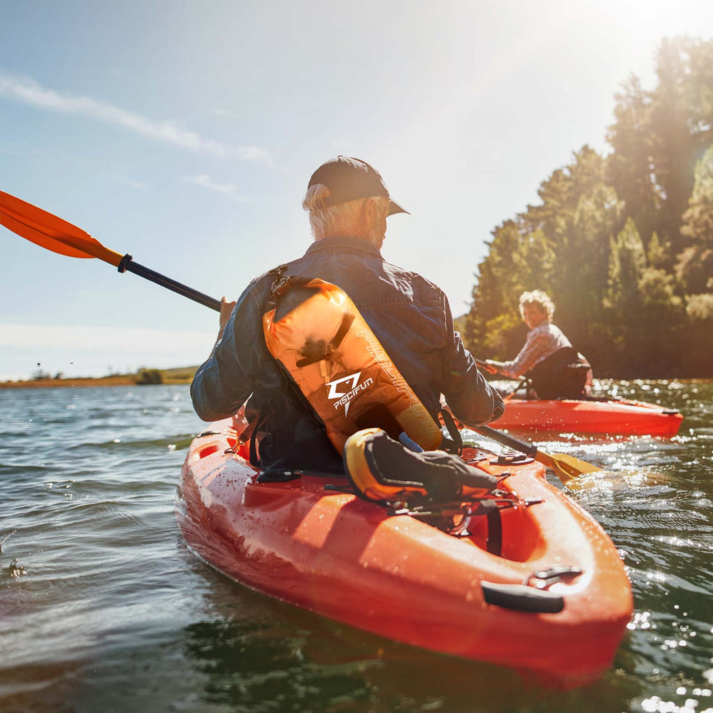 A couple kayaking on a lake with Piscifun® Waterproof Dry Bag, showcasing outdoor recreation and water sports.